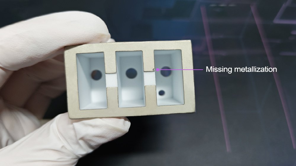 Hermetic seal failure showing missing metallization defect in the mo-mn layer of a sintered ceramic component