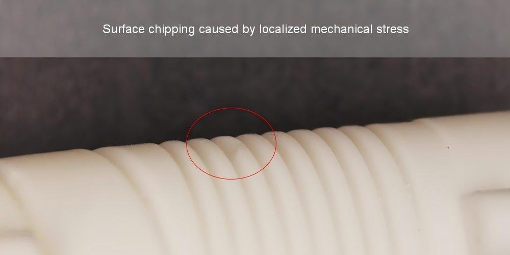 Surface chipping damage on an engineering ceramic component caused by localized mechanical stress